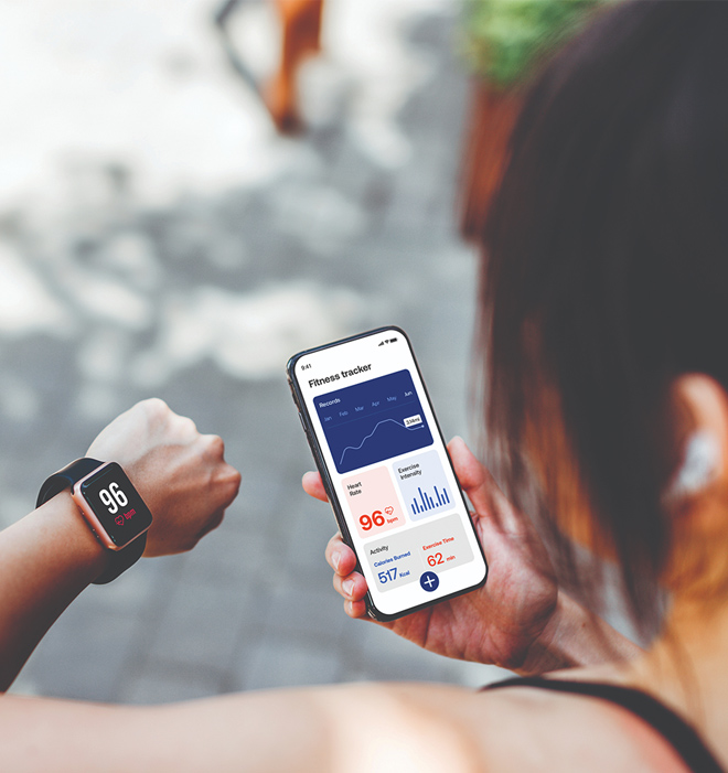 Person holding a smartphone displaying the Cigna Wellbeing App interface